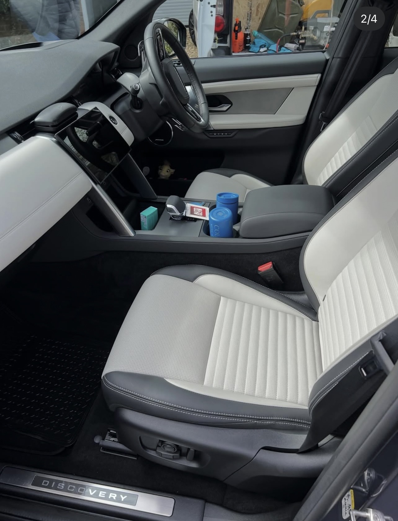 Freshly detailed Land Rover Discovery interior with pristine cream leather seats