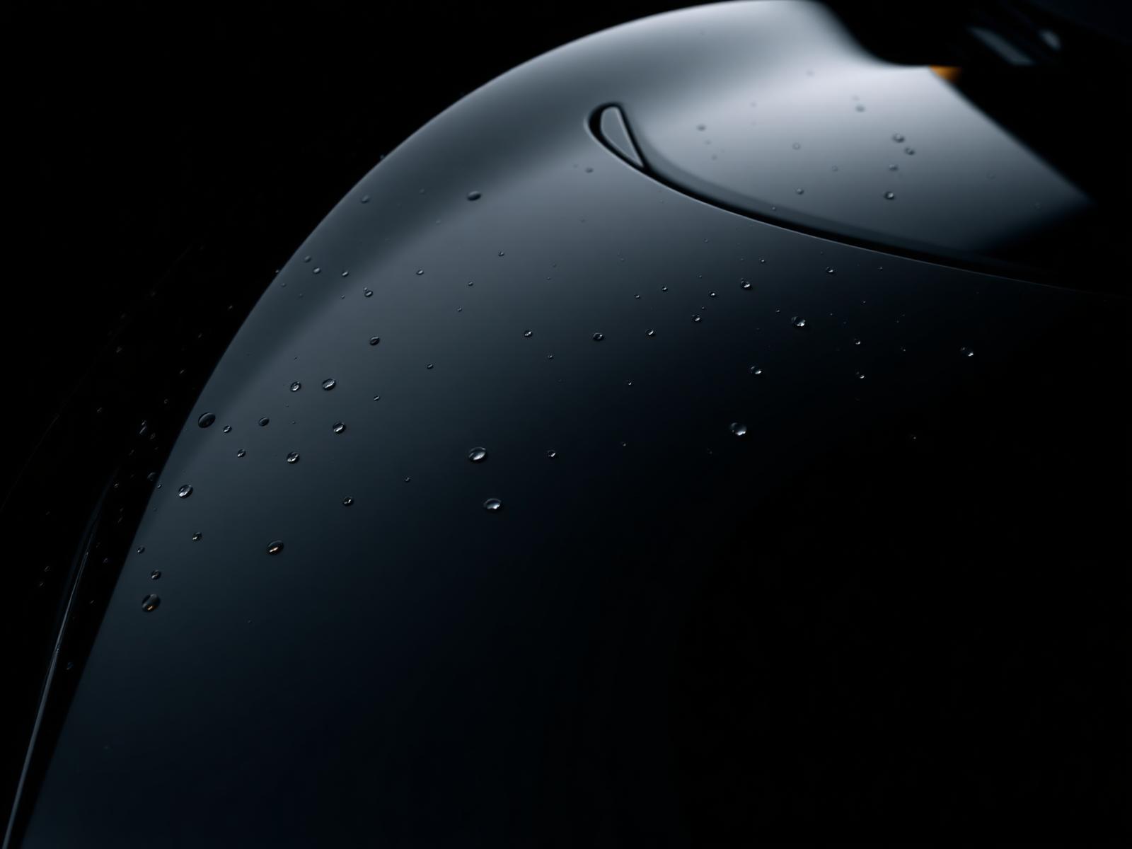 Freshly ceramic coated luxury car with water beading